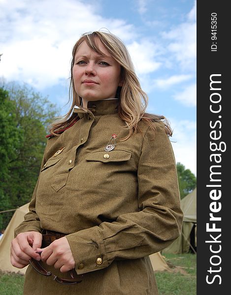 KIEV, UKRAINE - MAY 9: A member of history club called Red Star wear historical Soviet uniform as she participates in a WWII reenactment May 9, 2009 in Kiev, Ukraine. KIEV, UKRAINE - MAY 9: A member of history club called Red Star wear historical Soviet uniform as she participates in a WWII reenactment May 9, 2009 in Kiev, Ukraine