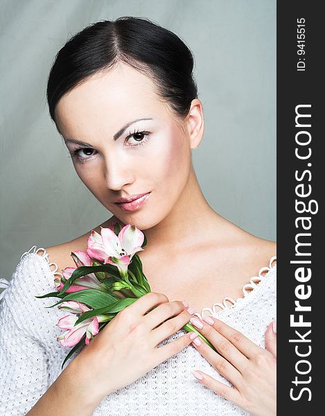 Portrait of young woman with pink orchid. Portrait of young woman with pink orchid