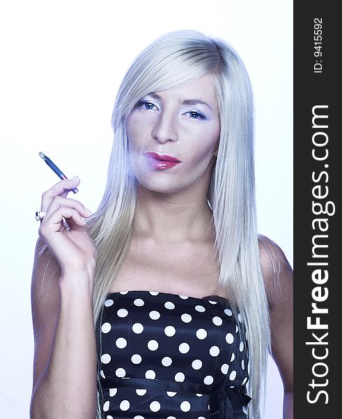 Portrait of  young blonde woman smoking cigarette. Portrait of  young blonde woman smoking cigarette