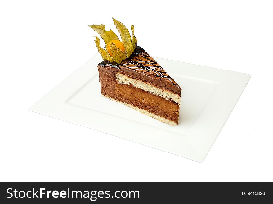 Chocolate cake with nut on white plate
