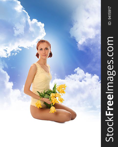 Cute young woman with yellow tulips. Cute young woman with yellow tulips