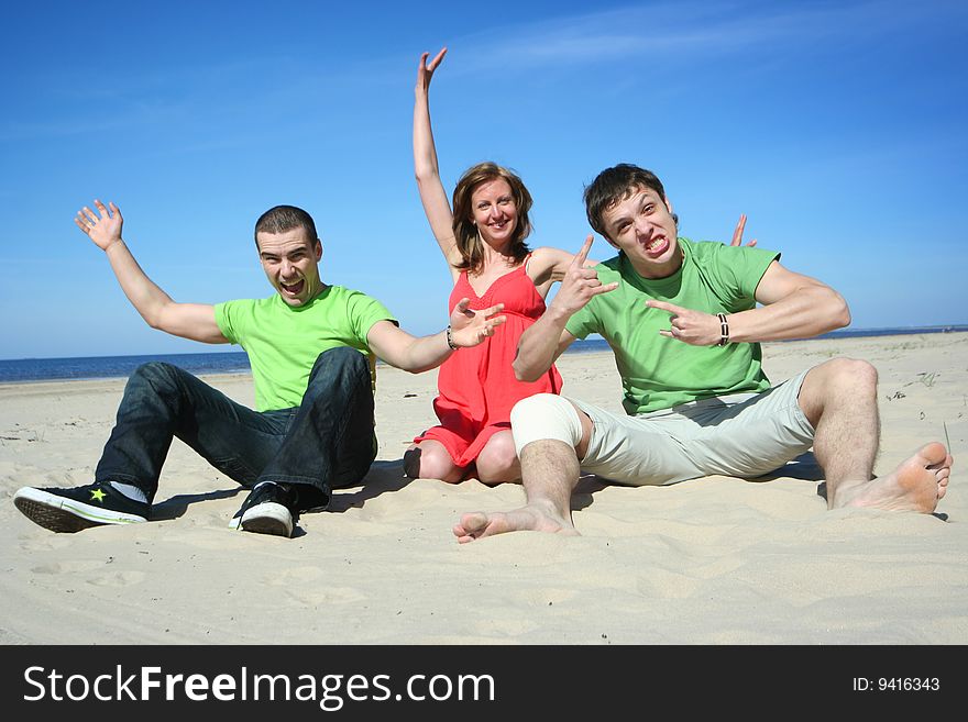 Group of friends having fun on the beach