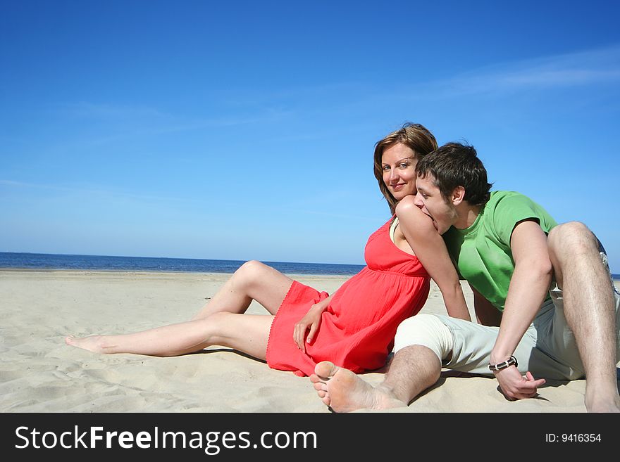 Young couple relaxing on the beach. Young couple relaxing on the beach