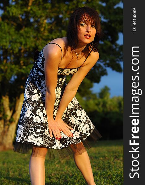 Happy looking young woman wearing a floral print dress