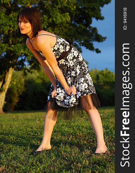 Happy looking young woman wearing a floral print dress