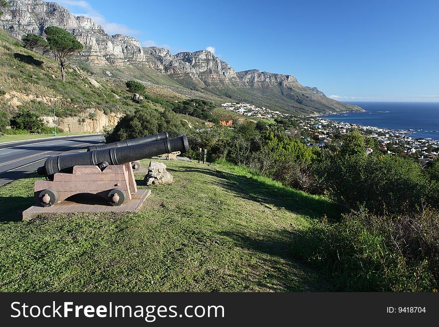 Two old antique cannon overlooking Camps Bay near Cape Town in South Africa.