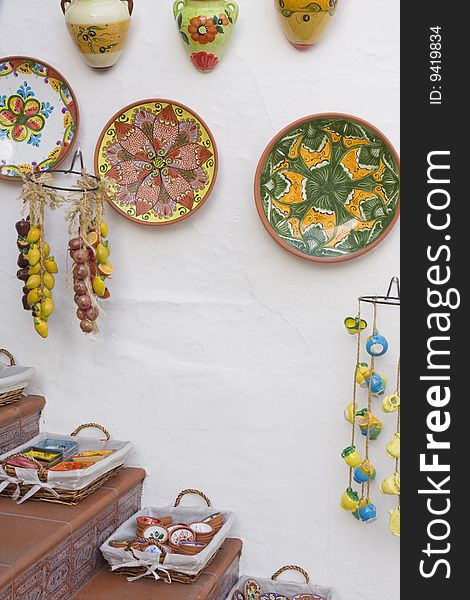 Brightly colored designs of a ceramics display outside a shop in Mijas, Spain invite visitors inside