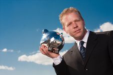 Listening To Piggy Bank Stock Image