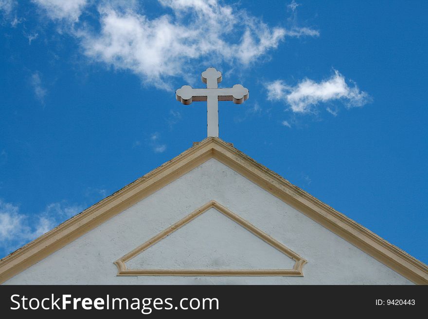 Church cross on a summer blue sky
