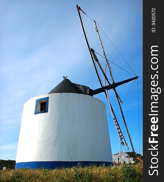 Portuguese functional white old windmill