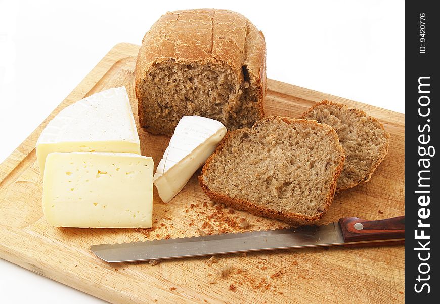 Bread and different cheeses on a white background. Bread and different cheeses on a white background
