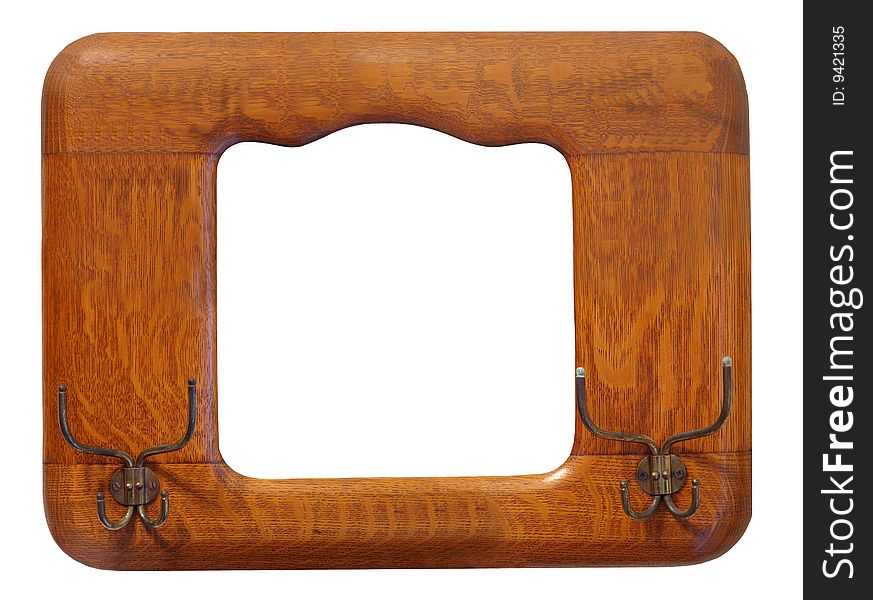 Isolated photo of an antique hat rack / picture frame made of oak. Isolated photo of an antique hat rack / picture frame made of oak