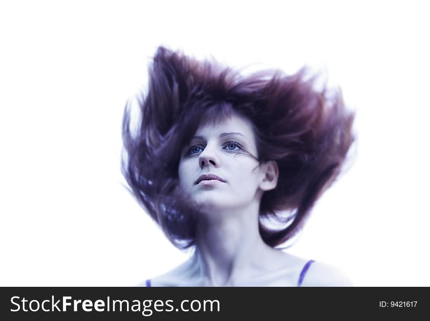 Young woman with blue eyes and red hair blowing by wind. Young woman with blue eyes and red hair blowing by wind