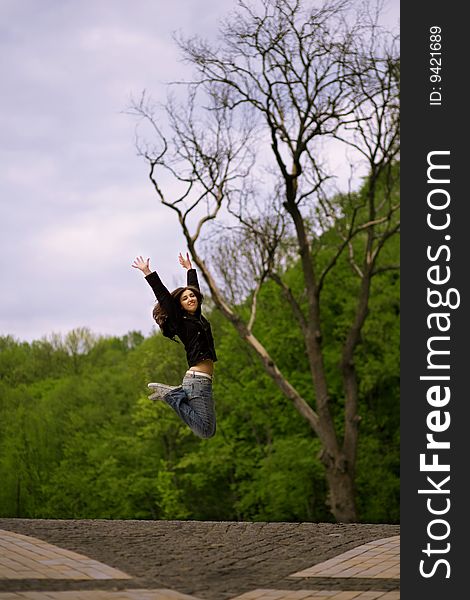 Young girl jumping in park