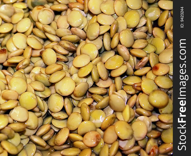 background of yellow lentils taken close-up