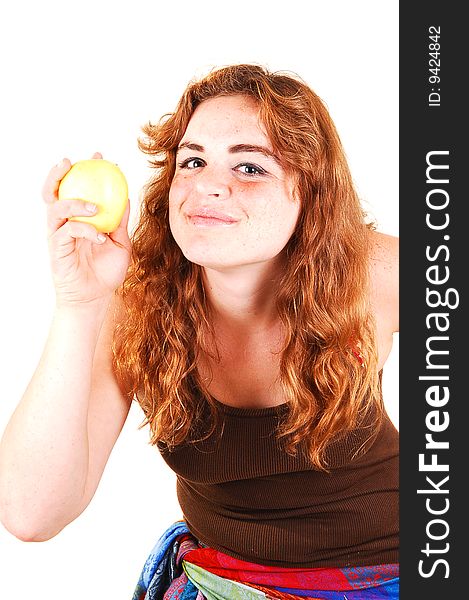 Pretty long red haired girl shows her yellow apple what she just started eating. Pretty long red haired girl shows her yellow apple what she just started eating.