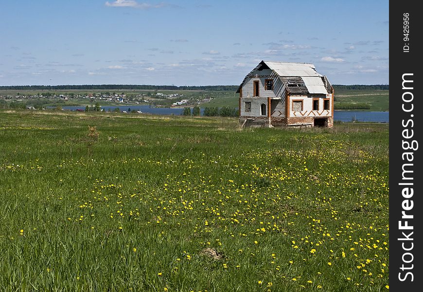 Abandoned House In The Green Field