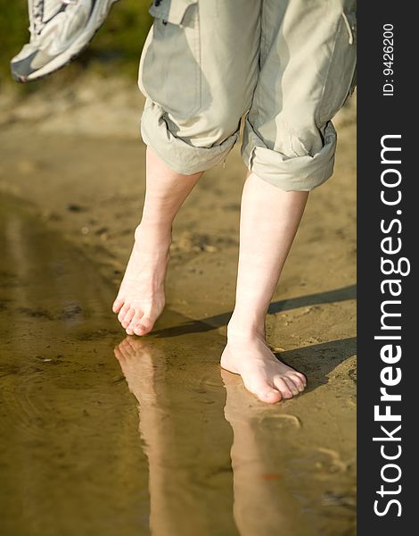 Barefoot Legs On Beach Sand