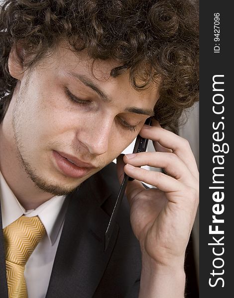 Close up portrait of business man with mobile phone