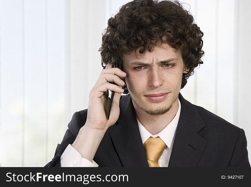 Business man with mobile phone in the office