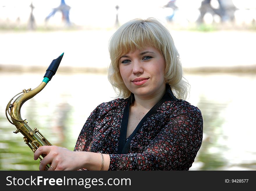 Girl Portrait With Saxophone