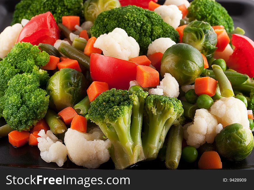 Vegetables: cauliflower, brussels sprouts, broccoli, carrots, string beans and tomatoes