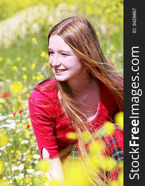 Girl With Long Hair On Summer Meadow
