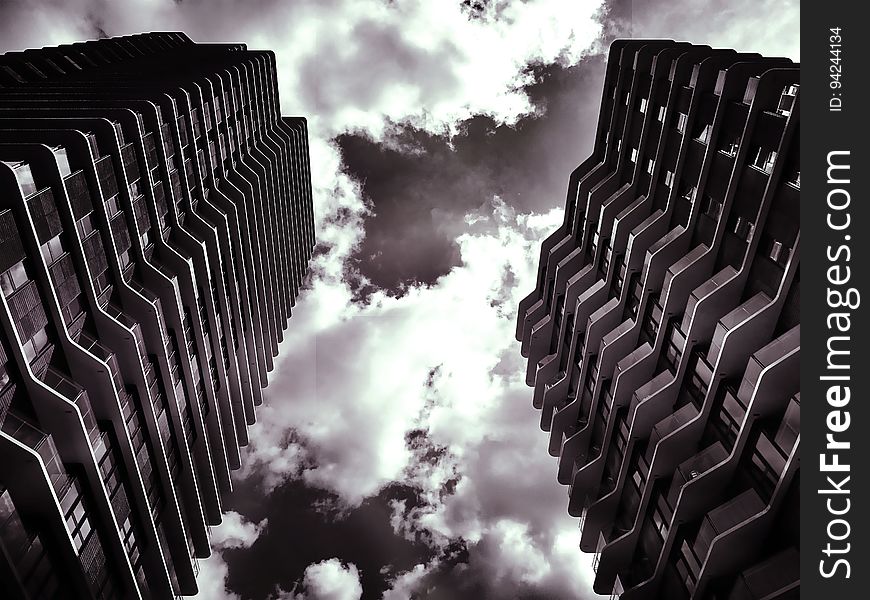 A black and white photo of two towering skyscrapers. A black and white photo of two towering skyscrapers.