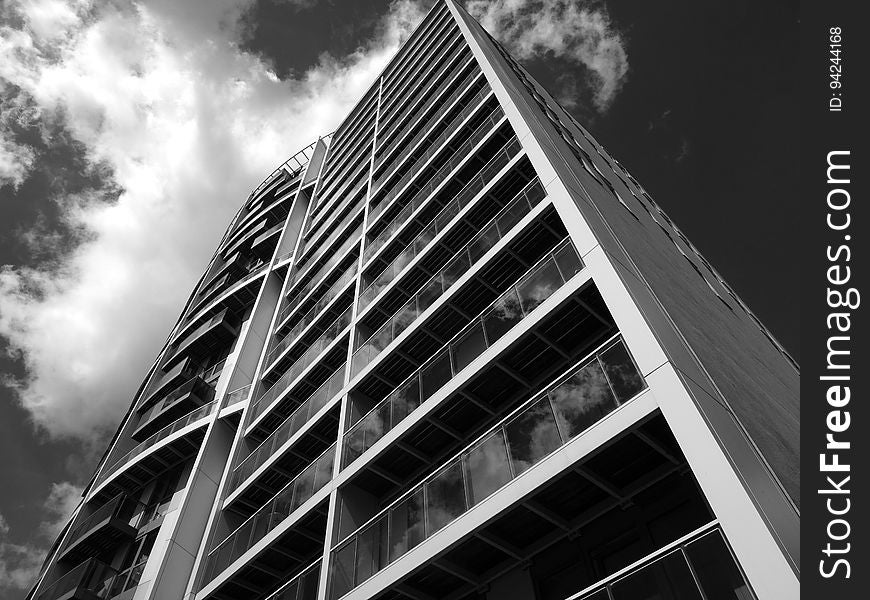 Almost abstract background of architectural design of high rise apartment block with both straight and curved balconies. Almost abstract background of architectural design of high rise apartment block with both straight and curved balconies.