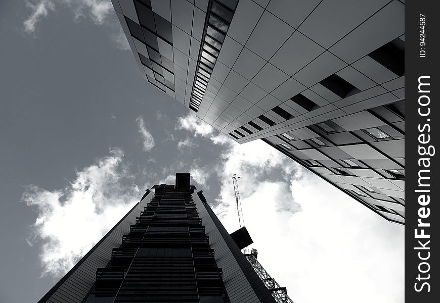 A view from the ground of towering buildings.