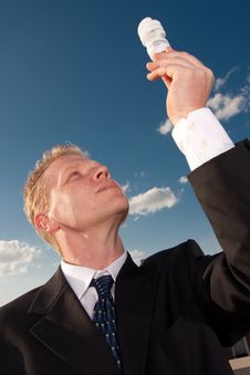 Businessman Holding Lightbulb Royalty Free Stock Photos Businessman Holding Lightbulb Royalty Free Stock Photos