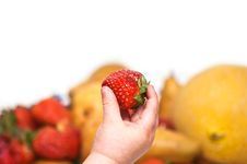 Baby S Hand With Strawberry Stock Image