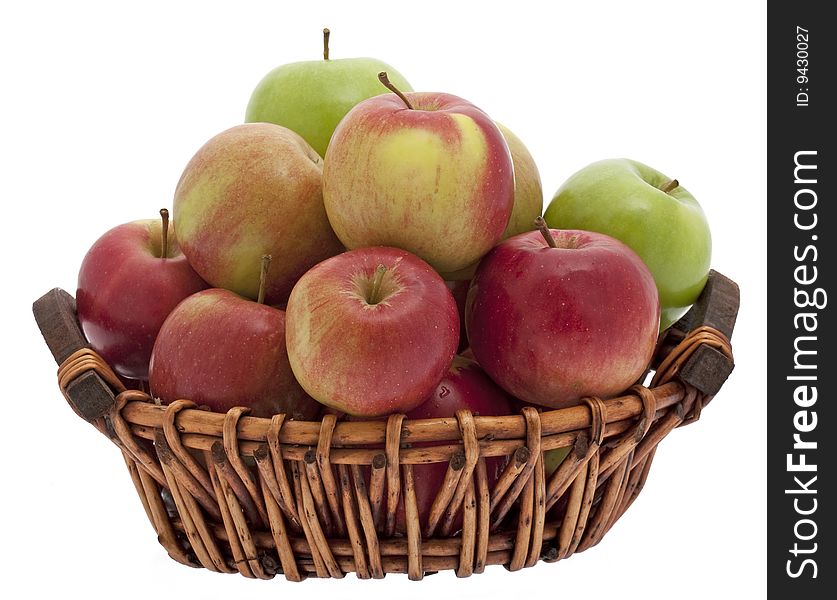 Apple basket, different apple types in a basket against a white background