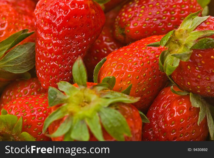 Closw-up fresh strawberries to background. Closw-up fresh strawberries to background