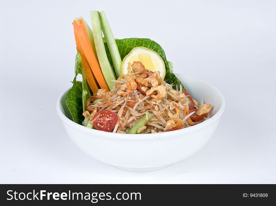 Shrimp noodle bowl with bean sprouts, carrots and cucumber.