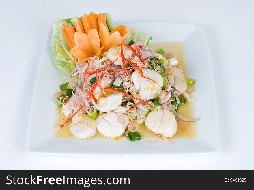 Fresh scallop salad with onions and red peppers