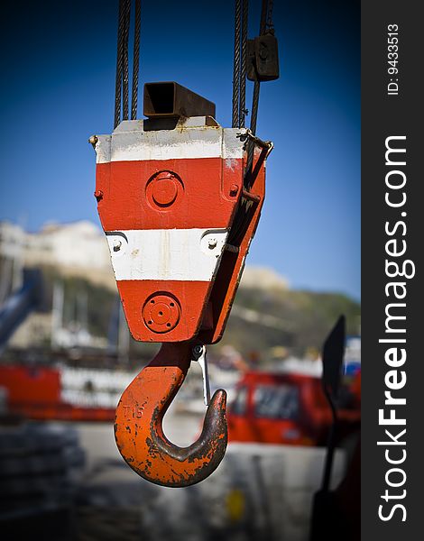 Detail of a hook of a crane to lift loads in a port