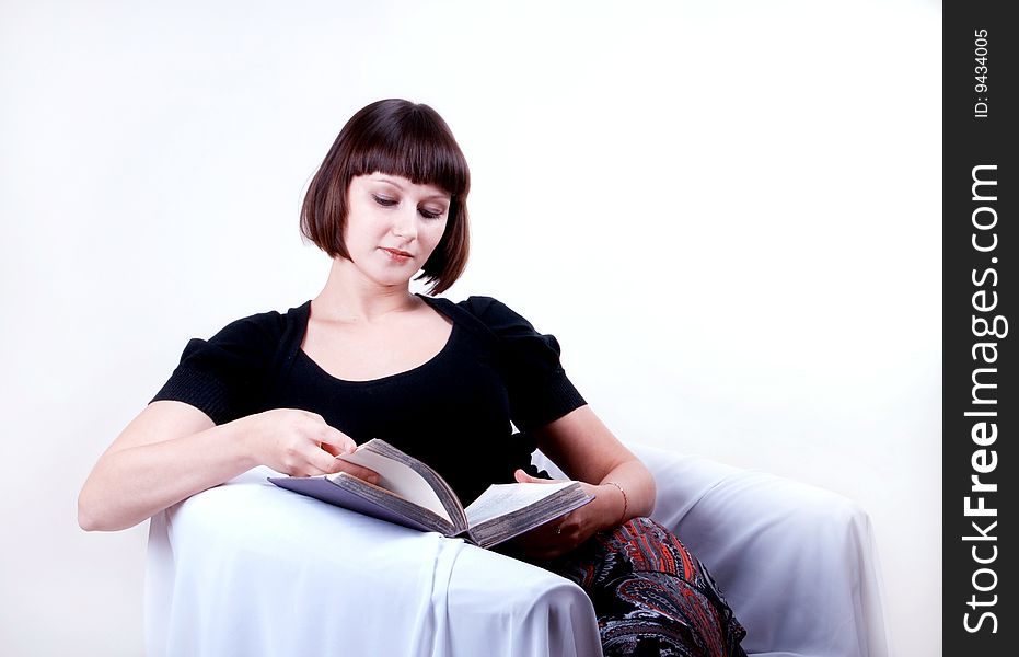 Young woman reading a book. Young woman reading a book