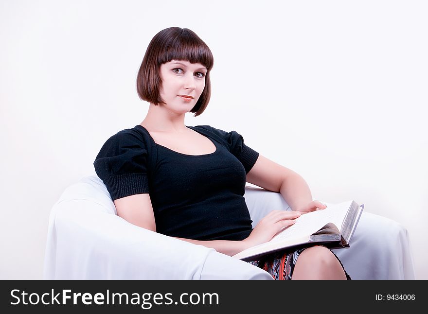 Young woman reading a book. Young woman reading a book