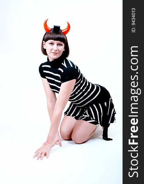 Portrait of a young woman with devilish horns. Portrait of a young woman with devilish horns