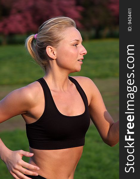 Young fitness woman running outdoor. Young fitness woman running outdoor