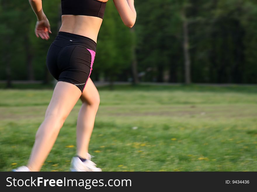 Young fitness woman running outdoor. Young fitness woman running outdoor