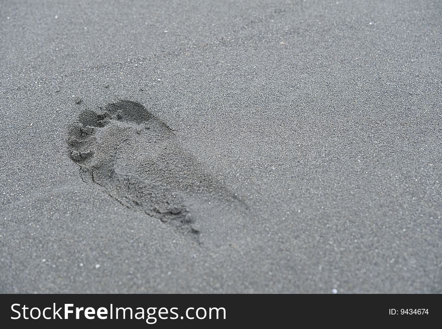 Foot print on the baeach of Japanese sea