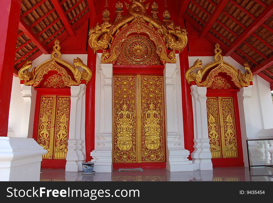 Red and gold painted doors in Thailand. Red and gold painted doors in Thailand