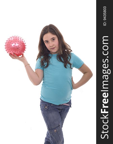 A young and cute girl holding a pink ball in her hand. A young and cute girl holding a pink ball in her hand