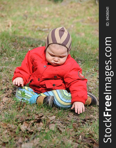 Little serious boy on walk