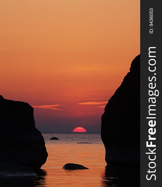 Rising sun between the rocks, Baltic Sea, Estonia