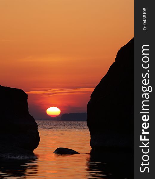 Rising sun between the rocks, Baltic Sea, Estonia
