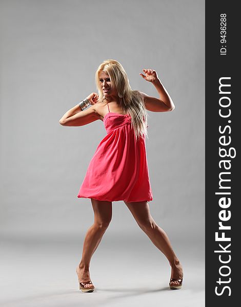 Modern style dancer posing on studio background. Modern style dancer posing on studio background