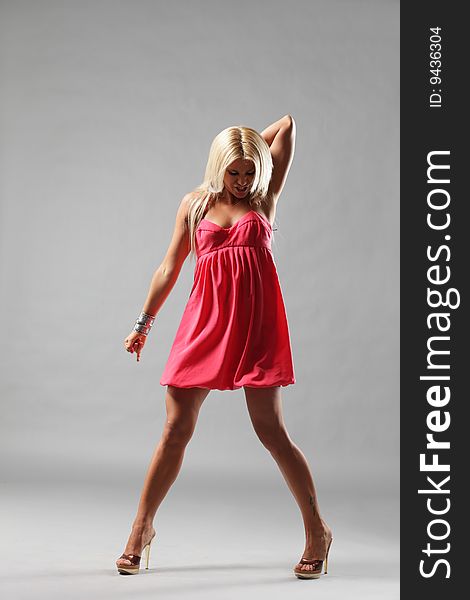 Modern style dancer posing on studio background. Modern style dancer posing on studio background